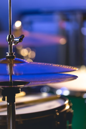 Drum cymbal close-up on a dark blurred background.の写真素材