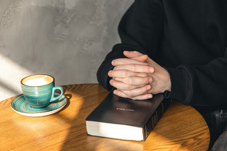 Close-up, a man reads the Bible in the morning.
