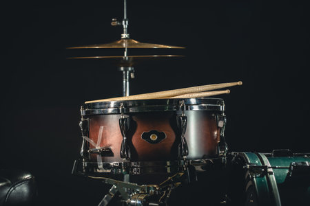 Drums on a black background close-up, percussion instrument on stage.の写真素材