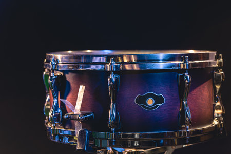 Beautiful snare drum on a black background, close up.の写真素材