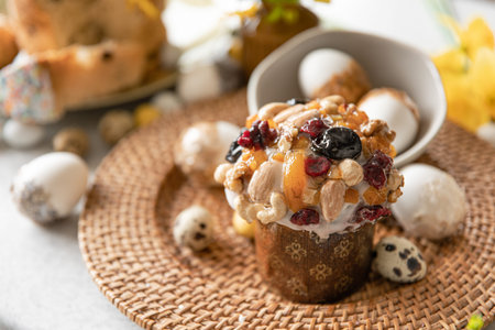 Easter composition with traditional pastries, decorative eggs and flowers.