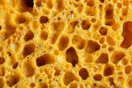 The texture of a yellow washcloth for the shower.の写真素材