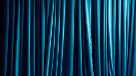 Closed blue drapes with satin velvet light effect for background.の素材