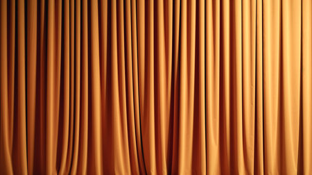 Closed orange drapes with satin velvet light effect for background.の素材
