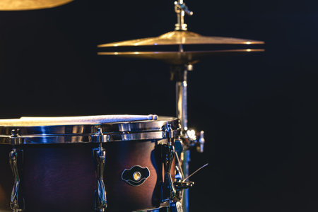 Snare drum and cymbals on a black background.の写真素材