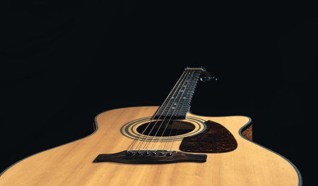 Close up of a classical light guitar low key.