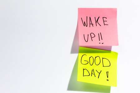Colored paper reminders with the wishes of a Good day and Wake up.の写真素材