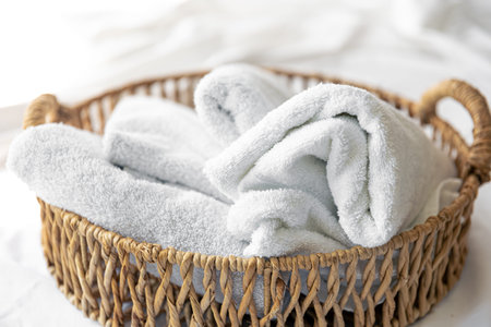 Spa composition with towels in a wicker basket.の写真素材