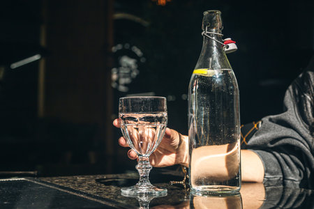 Drink water bottle with glass on table in the restaurant.の写真素材