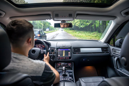 Hands on the wheel when driving from inside the car.の写真素材