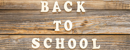 Back to school, banner with the inscription in wooden letters, top view.の写真素材