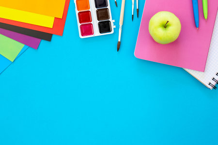 Various school education and office supplies, accessories on a blue background.の写真素材