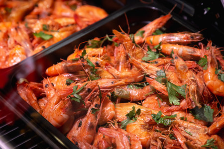 Fresh shrimp on ice at seafood restaurant buffet.