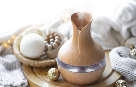 Still life with an aroma diffuser for moisturizing the air and winter decor.