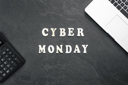 Creative flat lay promotion composition Cyber Monday text on a black background.の写真素材