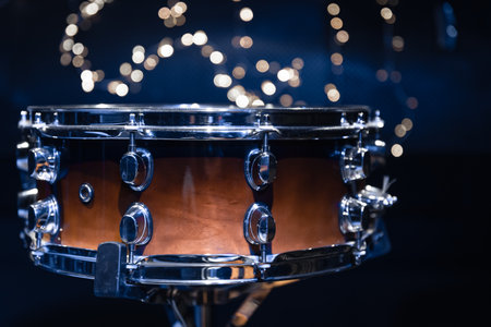 Close-up, snare drum on a blurred background with bokeh lights.の写真素材