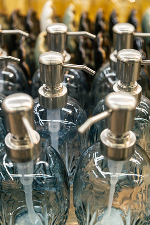 Containers for liquid soap or shampoo with a dispenser is sold in a supermarket.の写真素材