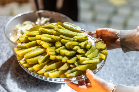 Close-up, sliced pickled cucumbers in a plate.の写真素材
