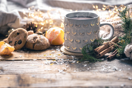 Winter composition with a cup of coffee, cinnamon and cookies.の写真素材