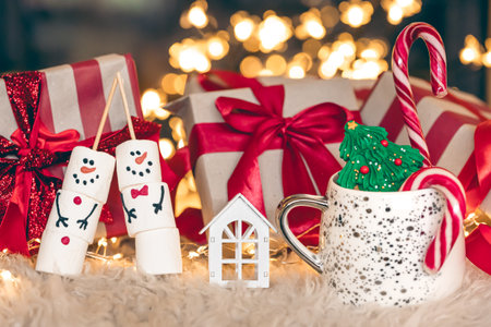 Christmas gift box by the fireplace, copy space.の写真素材