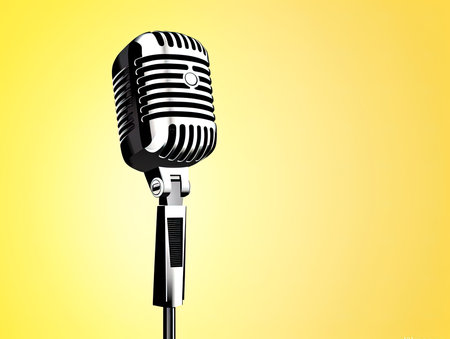 Classic retro voice microphone instrument on a yellow background.の素材