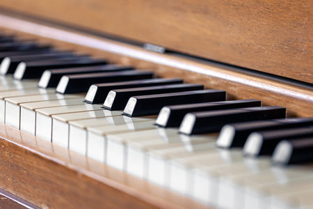 Close-up, keys of an antique wooden piano.