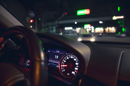 Close-up, car speed indicators in a car at night.の写真素材