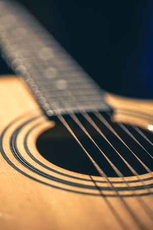 Close up of guitar and strings with shallow depth of field, soft focus.の写真素材