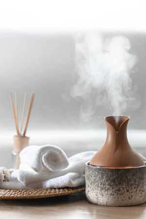 Essential oil aroma diffuser humidifier diffusing water articles in the air.の写真素材