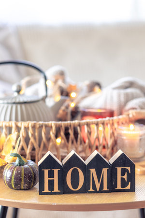Autumn composition with the inscription home. Still life in the home interior.の写真素材