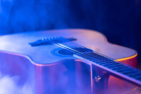 Close up of guitar and strings with shallow depth of field, soft focus.の写真素材