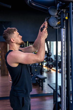Ahlete doing push-ups in the gym with a bare torso. Sport lifestyle.の写真素材