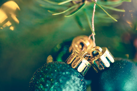 Blue Christmas balls on a Christmas tree branch, macro shot.の写真素材