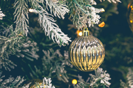 Gold Christmas decorations on the Christmas tree close-up.の写真素材