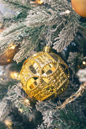 Close-up, golden ball on a Christmas tree close-up.の写真素材