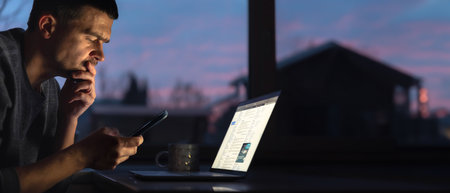 A young man works on a laptop. Man with laptop.の写真素材