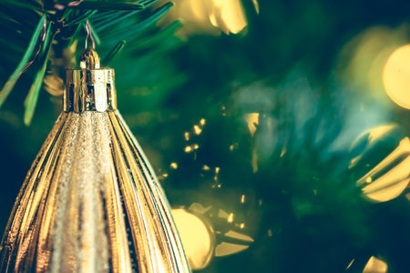 Christmas tree decoration close up, ball bauble in pine branches background.の写真素材