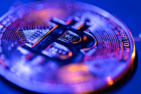 Bitcoin coin close-up in blue color. Finance concept.の写真素材