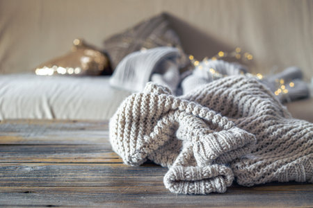 Warm winter sweater on a wooden table. Christmas concept.の写真素材
