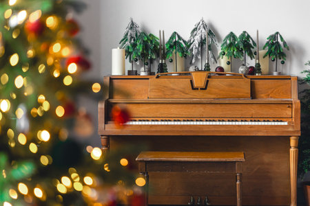 Wooden piano in an interior decorated for Christmas.の写真素材