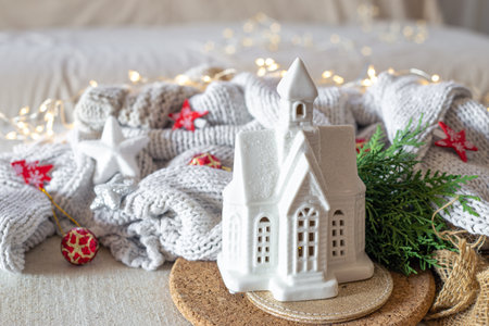 A cozy Christmas composition with a warm sweater and Christmas decorations.の写真素材