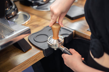 Close-up of hand Barista cafe making coffee. Barista with coffee.の写真素材