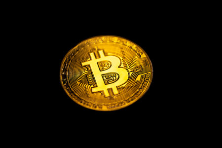 Bitcoin coin close-up on a black background. Background with cryptocurrency.の写真素材