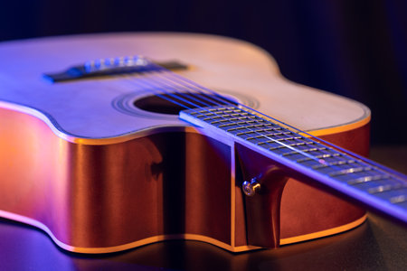 Close up of guitar and strings with shallow depth of field, soft focus.の写真素材