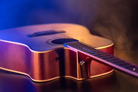 Close up of guitar and strings with shallow depth of field, soft focus.の写真素材