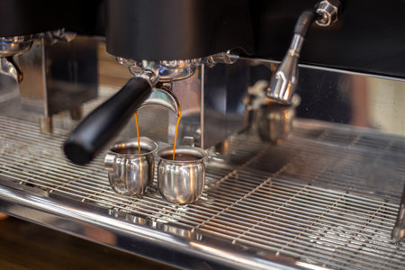 Making coffee by a barista in a coffee machine. The coffee machine makes coffee.の写真素材