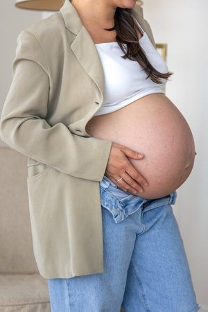 Belly of a pregnant stylish woman. Concept of style and pregnancy.の写真素材