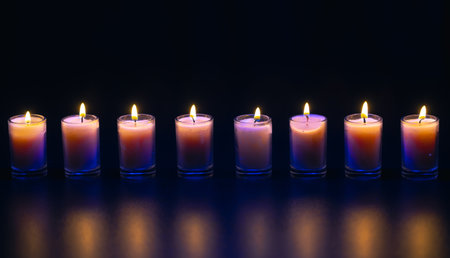 Burning candle on black background with backlight. Memorial Day.の写真素材