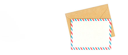 An envelope and a postcard on a white background. Copy space.の写真素材