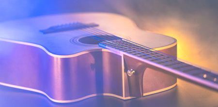 Close up of guitar and strings with shallow depth of field, soft focus.